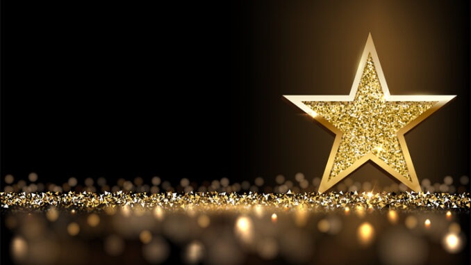 Golden sparkling star isolated on dark luxury horizontal background. Vector design element.