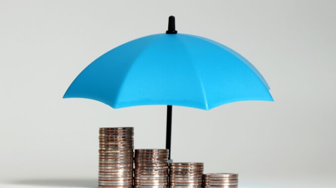 A pile of coins and open blue umbrellas.