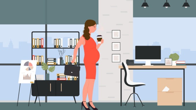 Beautiful smiling pregnant business woman in office interior