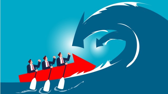 Challenging risks and crises, fearlessness, determination and courage to overcome difficulties or defeat setbacks, the business team paddles through the waves of the descent