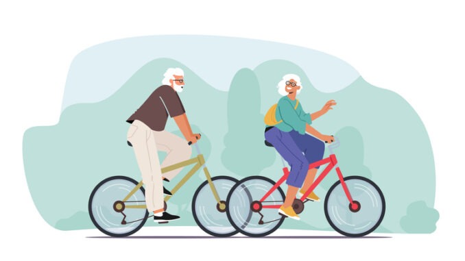 Couple of Cheerful Seniors Riding Bicycles, Man and Woman Pensioner Active Lifestyle, 