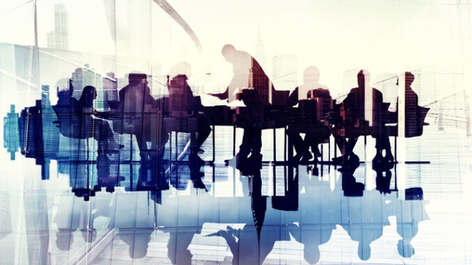 Abstract Image of Business People's Silhouettes in a Meeting