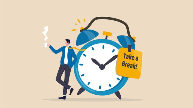 Time to take a break, coffee break time to relax and refresh from long stress interval, free from bored, sleepy and fatigue concept, relax businessman with a cup of coffee or tea with alarm clock.