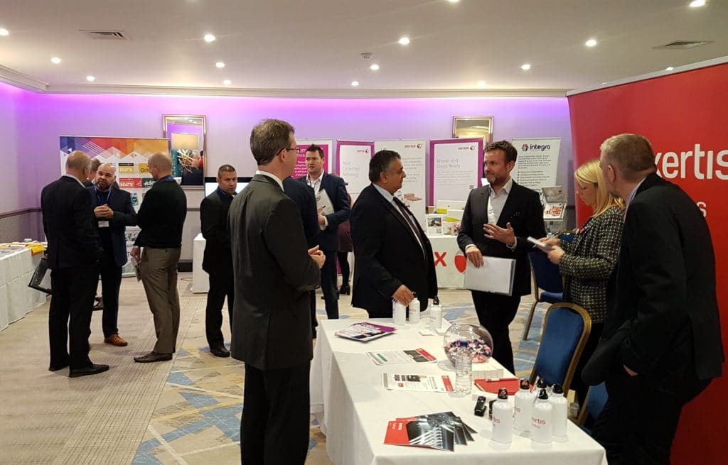 People attending Dealer Support Live and talking by the Exertis Supplies Stand.