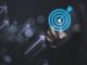 Businessman touching virtual dartboard with arrow ,Business Achievement objective target concept.