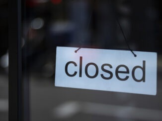 Closed sign in a shop window, central London during Covid-19 pandemic.