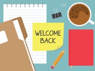 welcome back written on yellow sticky note