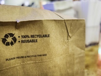 Brown paper bag that is 100% recyclable and reusable on a counter