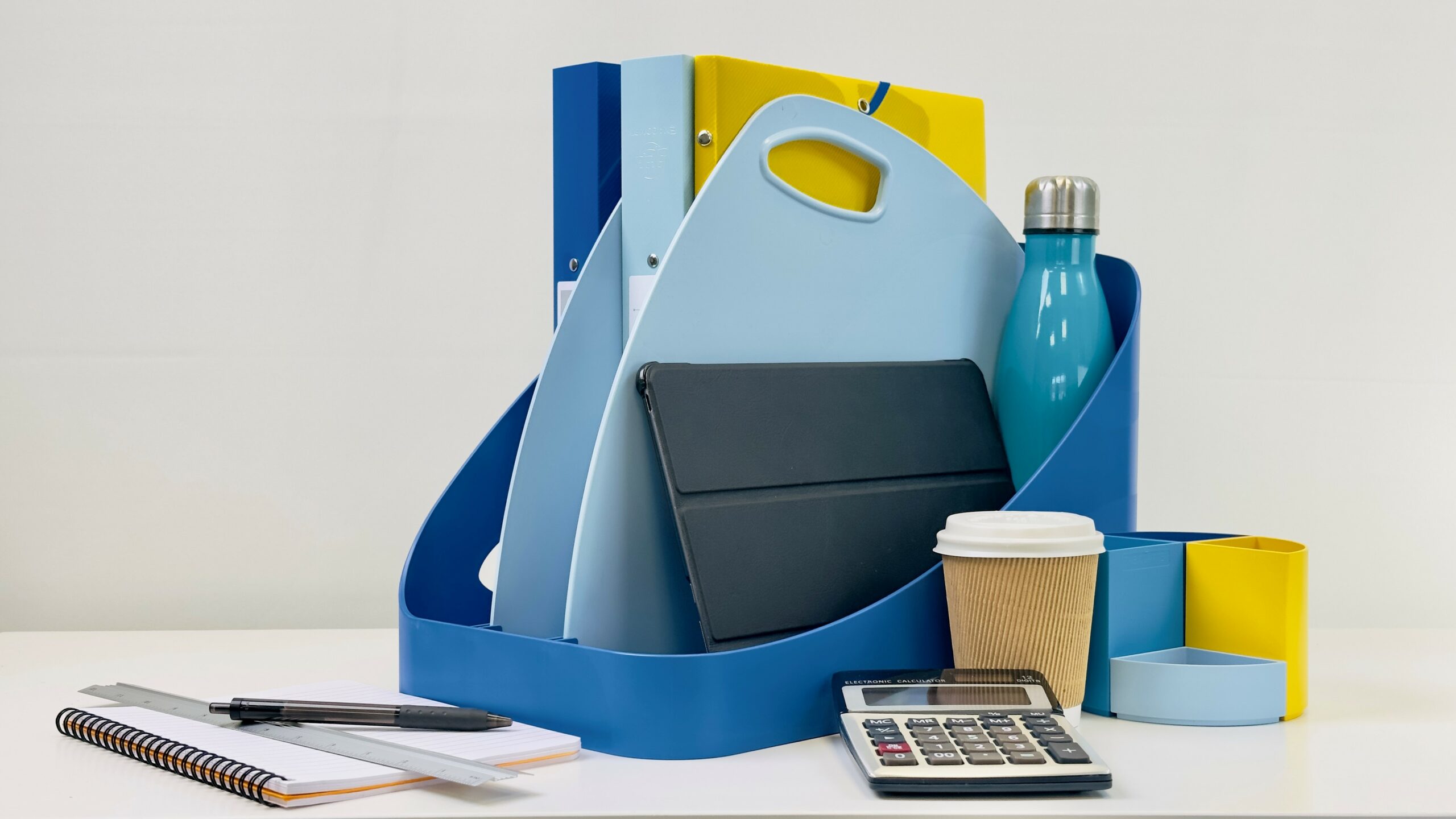 Exaclair Bee Blue FLEX BOX contains folders, a tablet and water bottle in shades of blue