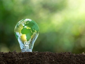 Renewable Energy.Environmental protection, renewable, sustainable energy sources. The green world map is on a light bulb that represents green energy Renewable energy that is important to the world