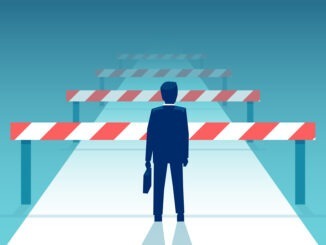 Vector of a challenged businessman standing in front of many obstacles and barriers on the way to success.