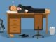 Businessman sleeping on his workdesk in the office