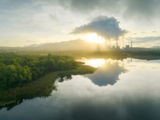 Aerial view coal power plant station in the morning mist.