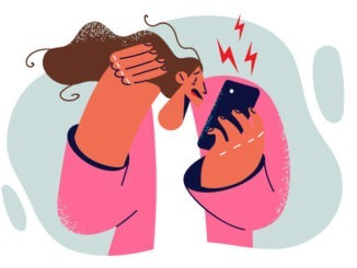 Woman stressed looking at mobile phone screen having to make a call