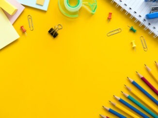 Colorful stationery on yellow background