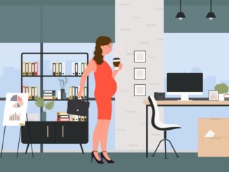 Beautiful smiling pregnant business woman in office interior