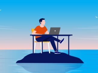 Man sitting at desk with computer alone on deserted island in solitude, peace and quiet