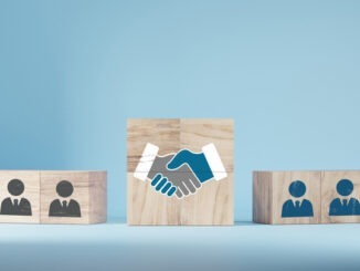 hand shaking icon on wooden cube blocks and human in circle icon for business deal