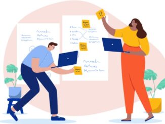 Two businesspeople working on project planning together using creative tools